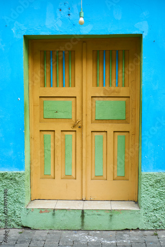 old wooden window on blue wall