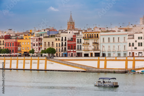 Wallpaper Mural View of the colorful buildings of the Triana district along the Guadalquivir River in Seville, Spain Torontodigital.ca