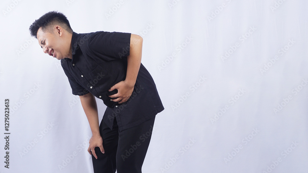 Asian Man Touching on His Stomach Suffering from Stomach Pain Isolated on White Background Asian Man Touching on His Stomach Suffering from Stomach Pain Isolated on White Background