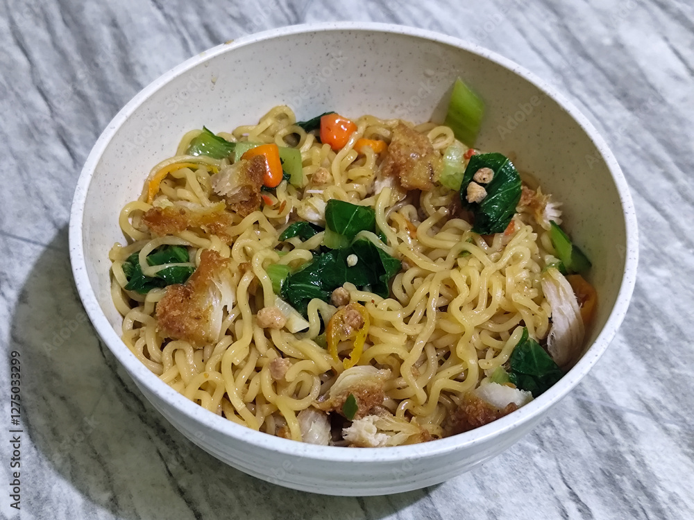 Soy sauce fried noodles served with pickles, chilies, vegetables, etc. Soy sauce fried noodles served with pickles, chilies, vegetables, etc.