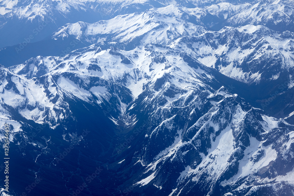 Obraz premium An Aerial View Above Snowy Mountain Tops