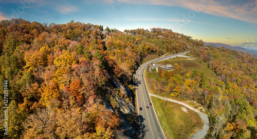 Wide multilane highway road in USA Appalachian mountains with fast driving cars. Above view of American transportation infrastructure photo