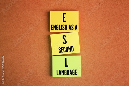 colored paper with the words English as a second language or ESL. the use of English by individuals whose mother tongue is different photo