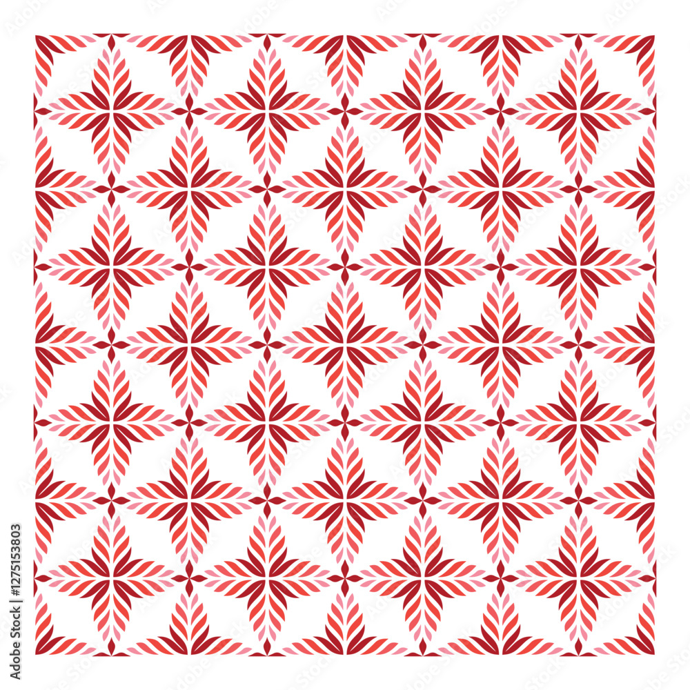 A vibrant repeating pattern of red and pink leaf-like motifs arranged in a star shape on a white background. A vibrant repeating pattern of red and pink leaf-like motifs arranged in a star shape on a white background.