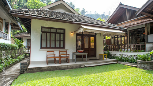 A simple two-story small house with white walls