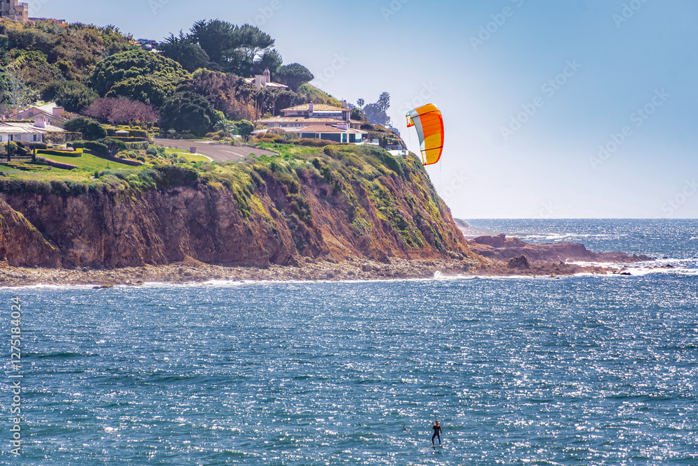 Man kite surfing - paddle surfing across the water in the South Bay - Palos Verdes coastline