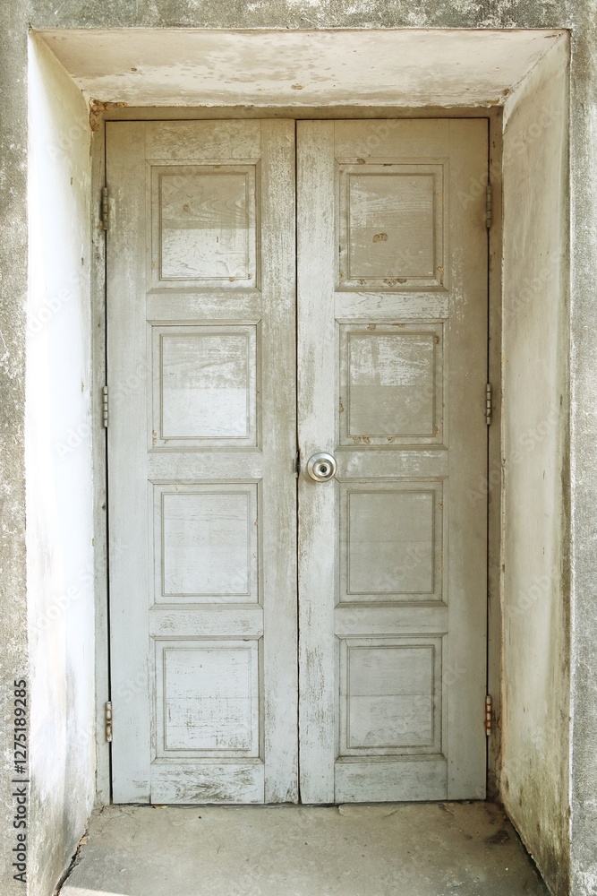 Old white painted wooden door entryway to building Old white painted wooden door entryway to building
