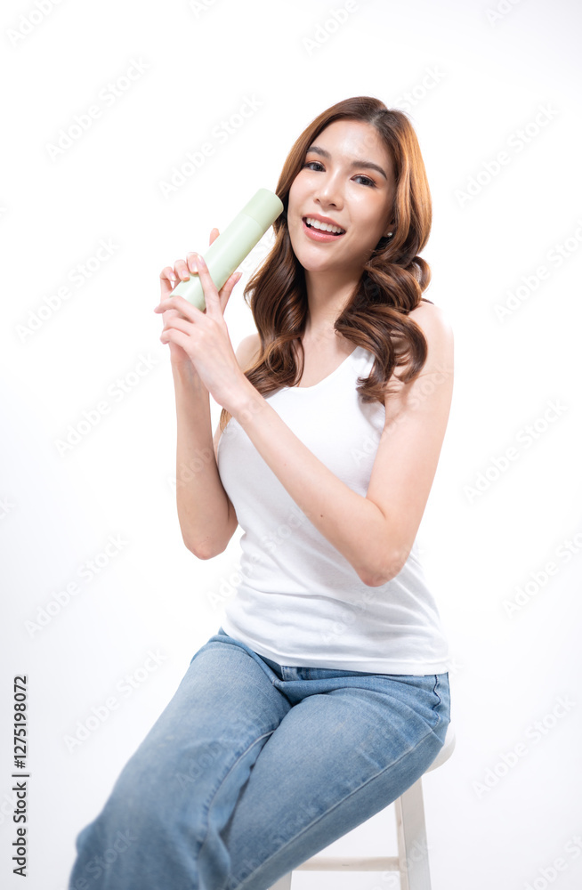 A portrait of a young Asian woman posing in a studio A portrait of a young Asian woman posing in a studio