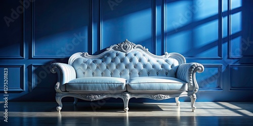 Elegant white vintage sofa, sharply silhouetted, graces a classic blue interior in this home décor photograph. photo