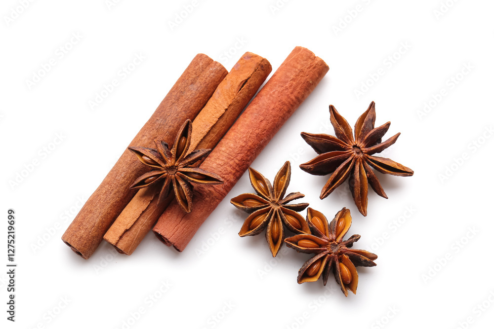 Star anise with cinnamon sticks on white background, top view Star anise with cinnamon sticks on white background, top view