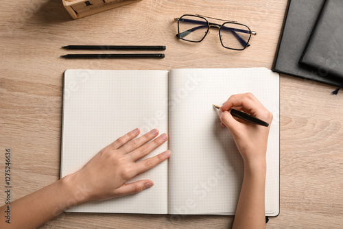 Woman writing something in ...
