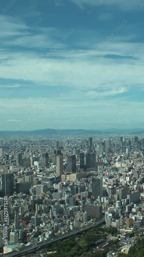 OSAKA, JAPAN : Aerial high angle view of CITYSCAPE of OSAKA in daytime. View of building and street around Namba, Shinsaibashi, Umeda and Osaka train station. Vertical time lapse shot from above. OSAKA, JAPAN : Aerial high angle view of CITYSCAPE of OSAKA in daytime. View of building and street around Namba, Shinsaibashi, Umeda and Osaka train station. Vertical time lapse shot from above.