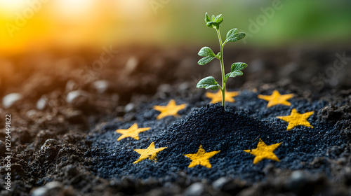 Seedling emerging from soil with European Union stars backdrop