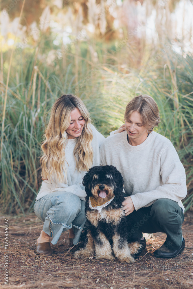 Young Couple Posing with their dog Young Couple Posing with their dog