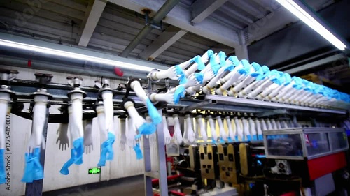 The automated production line in the production workshop of the nitrile glove factory is running for production