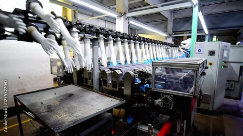 The automated production line in the production workshop of the nitrile glove factory is running for production