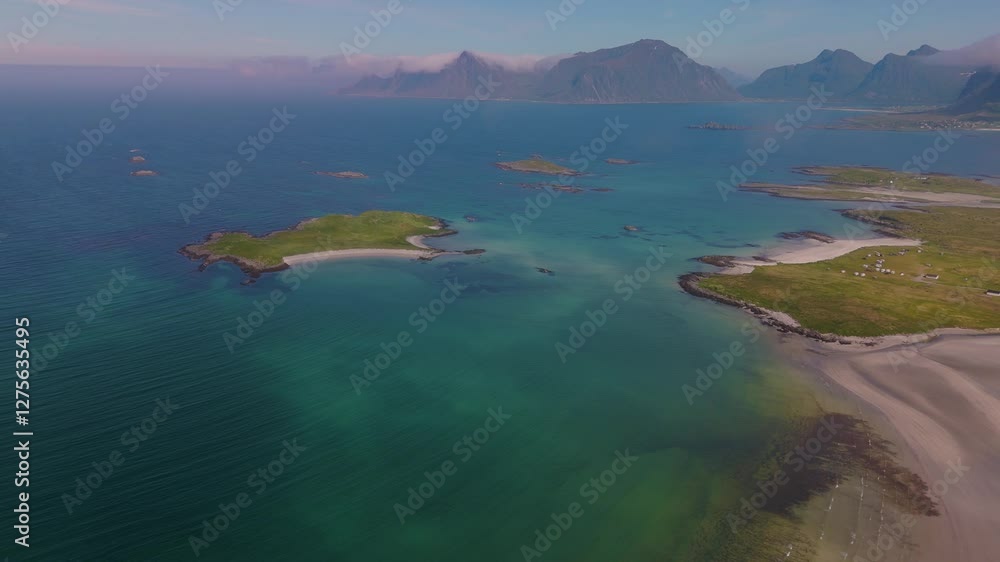 Experience the tranquil charm of Norway Lofoten coastline, where vivid blue waters gently meet lush green islands. Natures artistry unfolds along stunning shorelines under a clear sky. Experience the tranquil charm of Norway Lofoten coastline, where vivid blue waters gently meet lush green islands. Natures artistry unfolds along stunning shorelines under a clear sky.