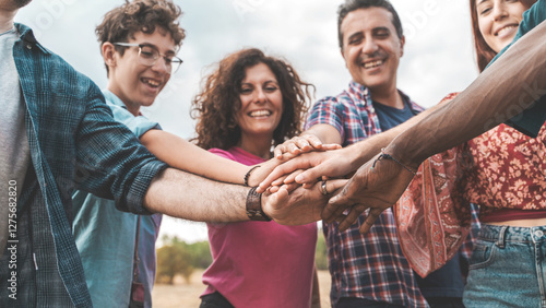 Bilde på lerret Collective Commitment: Diverse multigenerational team stacking hands for a shared goal and trust