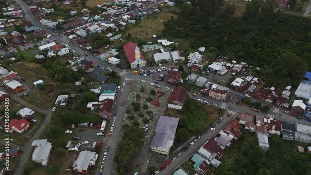 Aerial view of Chonchi, a charming town in the Los Lagos Region of Chile, showcasing its unique architecture and serene atmosphere. orbit motion Aerial view of Chonchi, a charming town in the Los Lagos Region of Chile, showcasing its unique architecture and serene atmosphere. orbit motion