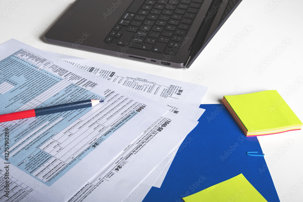 Accountant calculating taxes using laptop, Tax concept Accountant calculating taxes using laptop, Tax concept