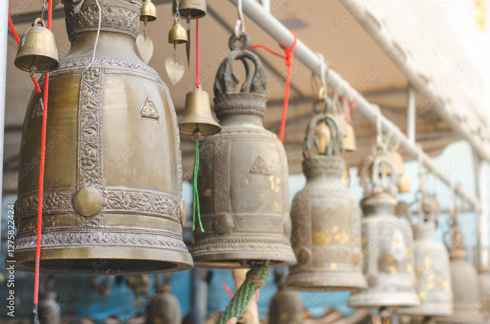 Bells hanging in a row at a market stall Bells hanging in a row at a market stall