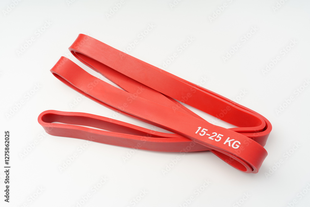 Fitness rubber band. Home exercise machine. Concept of sport and healthy active lifestyle. Set of colorful fitness rubber bands. Fitness rubber band. Home exercise machine. Concept of sport and healthy active lifestyle. Set of colorful fitness rubber bands.