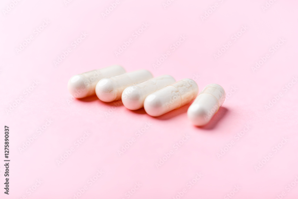 Biotin capsules. Bright background. Soft focus. Close up. Copy space Biotin capsules. Bright background. Soft focus. Close up. Copy space