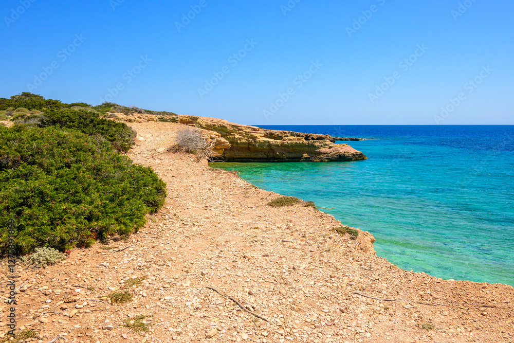Koufonisia beach with clear water and rock formations. The south of Ano Koufonisi. Small Cyclades, Greece