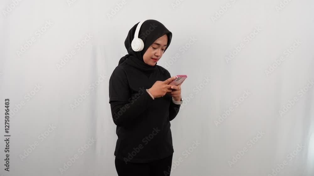 Asian woman wearing hijab exercising indoors Asian woman wearing hijab exercising indoors