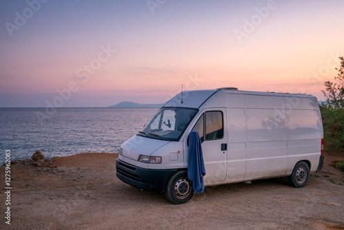 Van by the Greek Coast at Sunset with Scenic Views photo