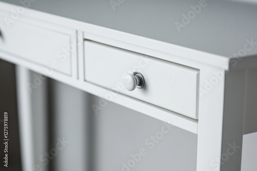 A close-up shot of a white desk with two drawers, perfect for office or home use