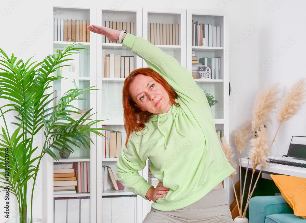 woman doing yoga and stretching exercises in her home. sport at home.