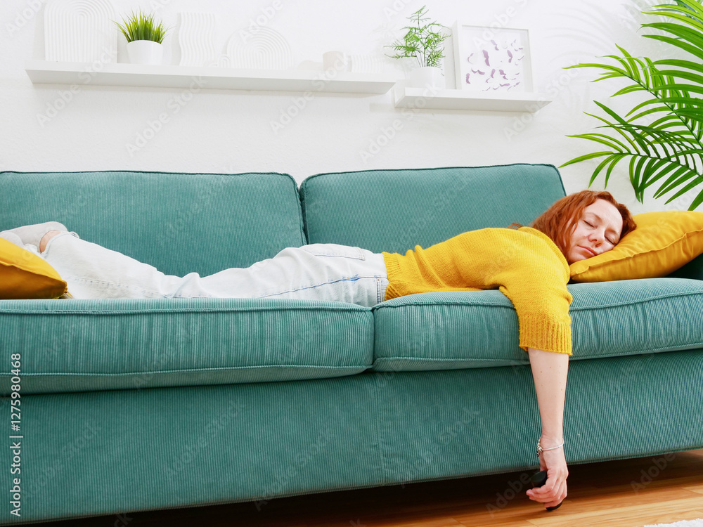 procrastination. Woman lying on sofa and holding remote control. leisure and leisure activity.