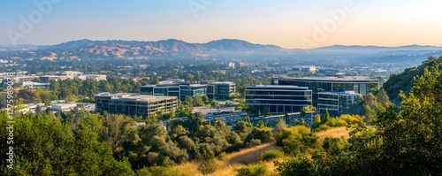 A panoramic view of Silicon Valley with modern office buildings, tech campuses, and rolling hills in the background