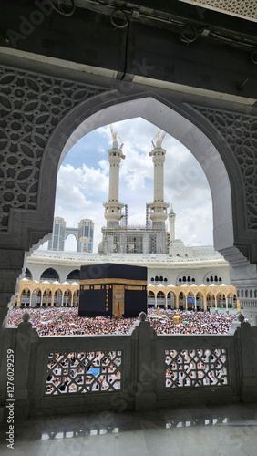 Mecca, Saudi Arabia - April 4, 2024 : Umrah pilgrims from different countries in the courtyard of the Grand Mosque, Mecca, during the month of Ramadan 1445 H.
