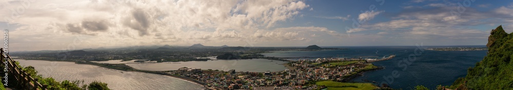 Panoramic Coastal Landscape with City, Harbor, Rolling Hills, and Vast Ocean from Hallasan Mountain Overlook Panoramic Coastal Landscape with City, Harbor, Rolling Hills, and Vast Ocean from Hallasan Mountain Overlook
