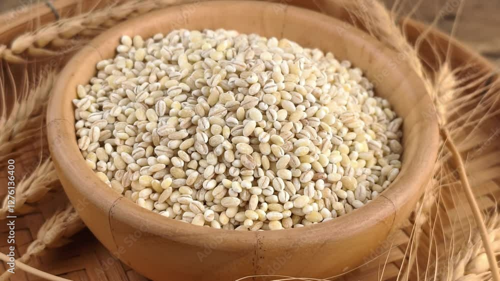 Rotate the dried barley in a wooden bowl. Rotate the dried barley in a wooden bowl.