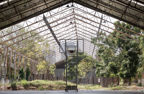 Obraz na płótnie Basketball backboard with the hoop metal ring inside indoor basketball court at city park. use it as your Space for text, Design, Wallpaper and Poster, Selective focus. w salonie