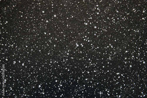 Black spotted texture, black ceramic chips texture as background