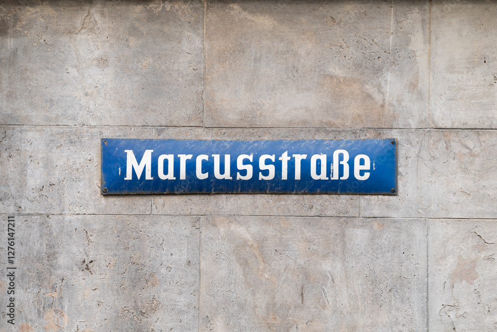 Marcusstraße street sign in Würzburg, Germany. Road name in the inner city in the old town district. Signage on a wall showing the direction at an intersection. Marcusstraße street sign in Würzburg, Germany. Road name in the inner city in the old town district. Signage on a wall showing the direction at an intersection.