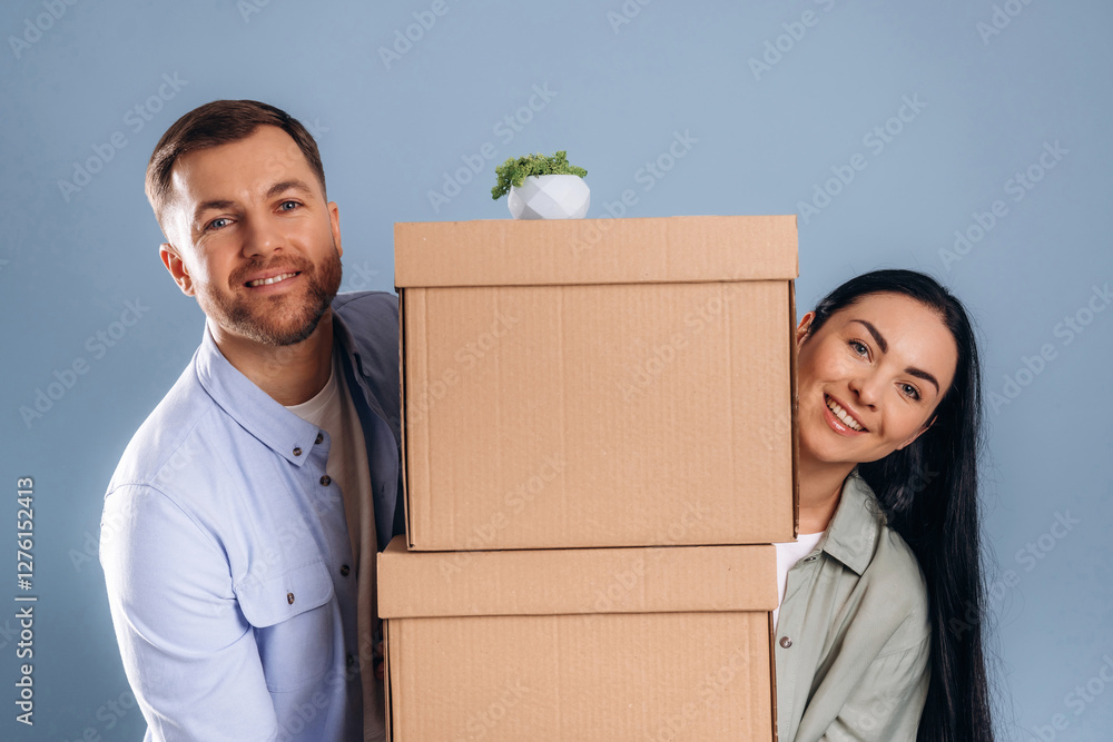 Time to move, with boxes. Man and woman are in the studio Time to move, with boxes. Man and woman are in the studio