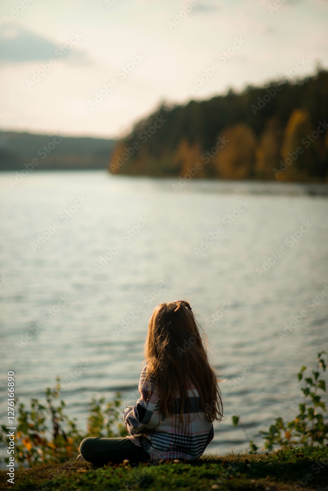 portrait of a five year old girl standing near a lake portrait of a five year old girl standing near a lake