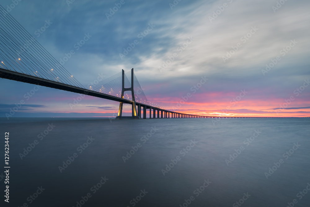 Fototapeta premium Vasco da Gama bridge over tagus (Tejo) river in Lisbon, Portugal, before sunrise