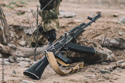 Принти на полотні A Kalashnikov assault rifle is lying on ground