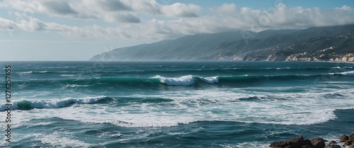 Dynamic Waves Crashing Against Rocky Shoreline in Costa Vincentina National Park under Dramatic Cloudy Sky photo