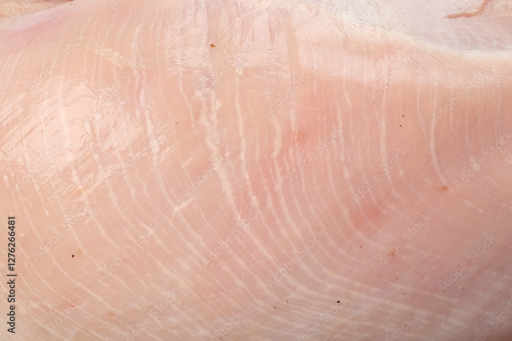 Fototapeta premium Raw turkey breast as background, closeup view