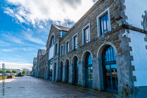 A view along the old warehouses on the upper reaches of the Penfold river at Brest, France on a sunny day in autumn photo