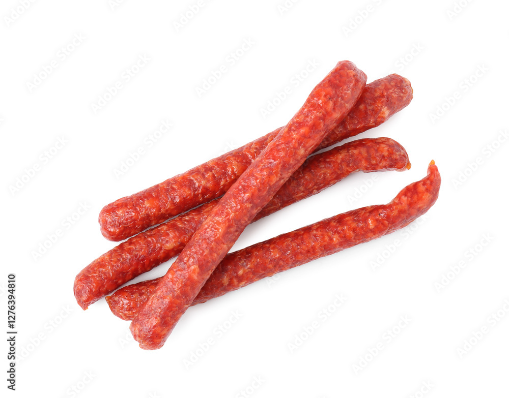 Many thin dry cured sausages isolated on white, top view Many thin dry cured sausages isolated on white, top view