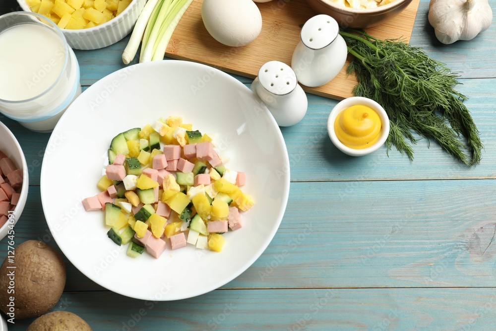Ingredients for okroshka soup on light blue wooden table, flat lay. Space for text Ingredients for okroshka soup on light blue wooden table, flat lay. Space for text