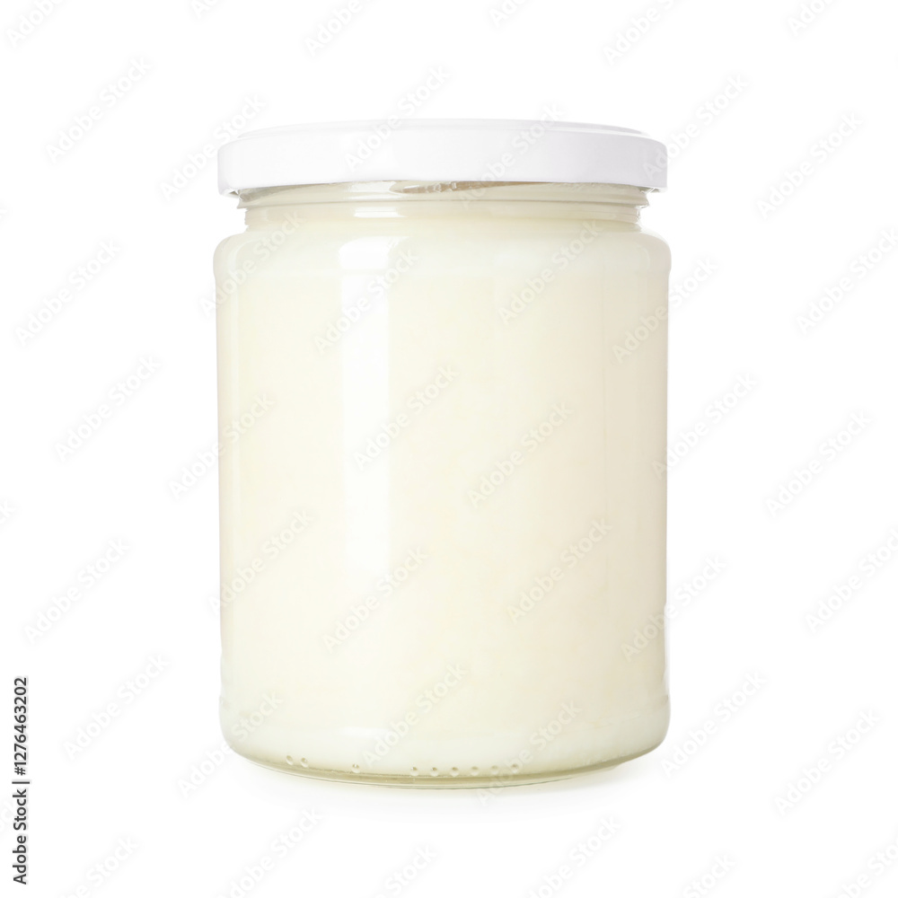 Organic coconut cooking oil in glass jar isolated on white Organic coconut cooking oil in glass jar isolated on white